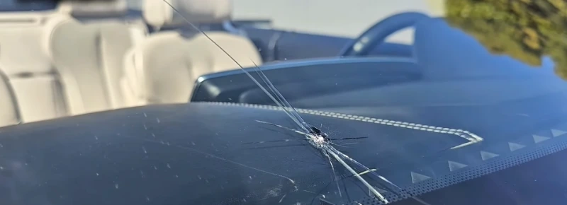 Hail damage windshield Leander TX — impact points and cracks after Williamson County storm