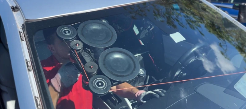 Mobile windshield replacement Leander TX β technician removing damaged windshield at customer home