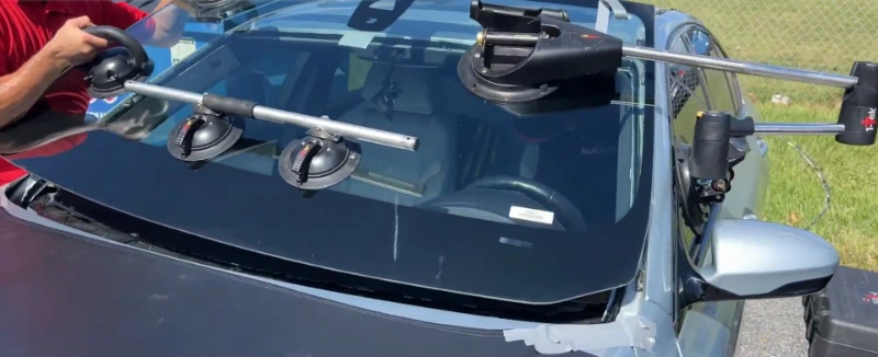 Windshield Leander Pros technician fitting new windshield during mobile service in Leander TX